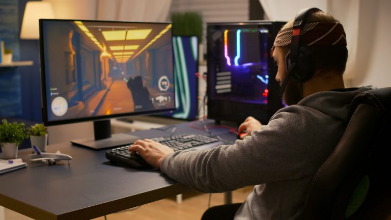 Gamer using desktop setup for AR VR experience